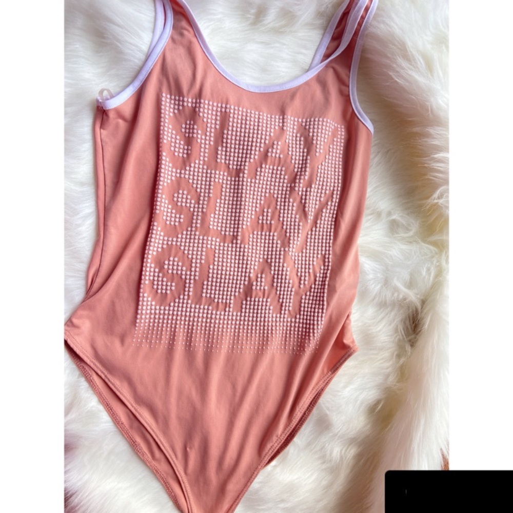Pink w/ White trim Body suit/